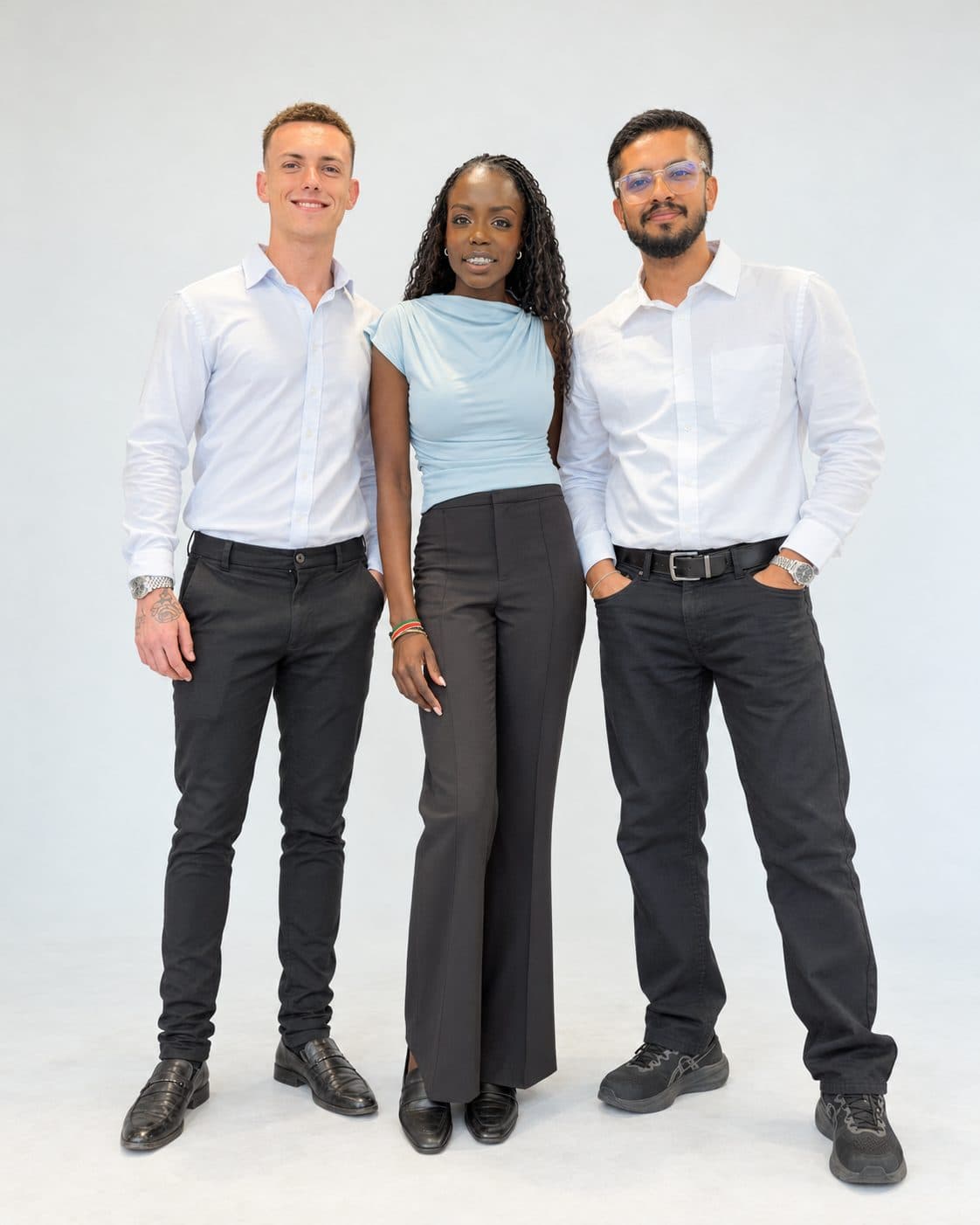 Jesse Goodinson, Akoi Chol and Zac Malik standing together in the studio.